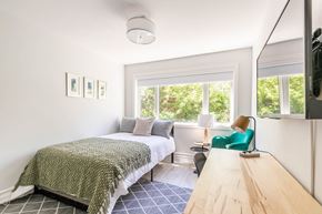 Ottawa apartment for rent - a bedroom with a bed and a window