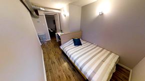 Ottawa apartment for rent - a bedroom with a bed in a small room