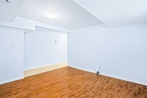 Ottawa apartment for rent - an empty room with wood floors and white walls