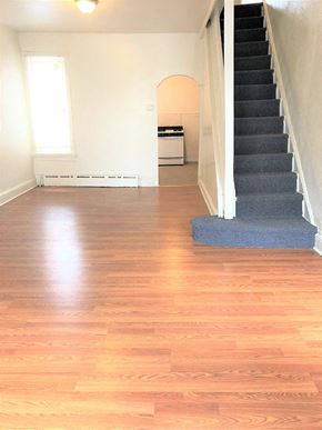 Philadelphia apartment for rent - A room with a staircase and a window.