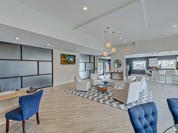 Greenville apartment for rent - a living room with couches and chairs and a table