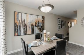 Nashville apartment for rent - a dining room table with chairs around it and a painting on the wall