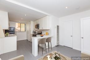 Oakland apartment for rent - A modern kitchen with a dining table and chairs.