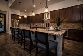 Reno apartment for rent - a kitchen with a large island with bar stools
