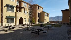 Reno apartment for rent - a group of picnic benches in front of a building