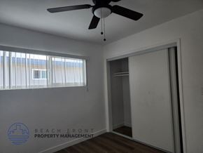 Lomita apartment for rent - A room with a ceiling fan and a window with blinds.