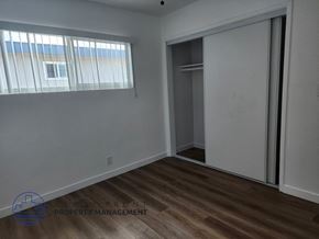 Lomita apartment for rent - an empty bedroom with a closet and a window