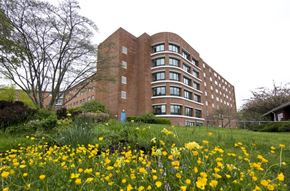 Trumbull apartment for rent - a building in the middle of a field of flowers