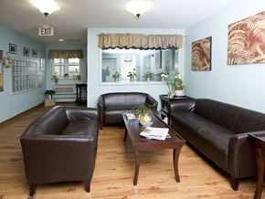 Bethel apartment for rent - a living room with leather couches and a coffee table