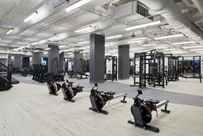 Seattle apartment for rent - A gym with exercise bikes and other equipment.