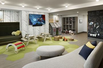 Seattle apartment for rent - A living room with a grey sofa and a painting on the wall.