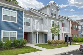 Cranbury apartment for rent - a row of town houses with a sidewalk in front of them