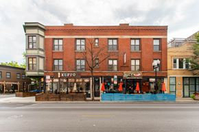 Chicago apartment for rent - a street view of a brick building on a city street