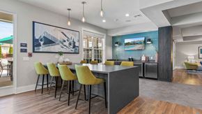 York apartment for rent - a dining area with a table and chairs and a kitchen