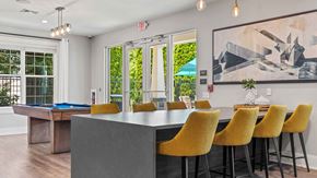 York apartment for rent - a dining room with a table and chairs and a pool table