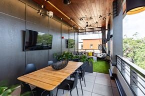 Savannah apartment for rent - a dining room with a wooden table and black chairs