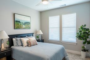 Savannah apartment for rent - a bedroom with a large bed and two windows