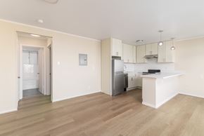 San Francisco apartment for rent - A kitchen with a refrigerator, sink, and cabinets.