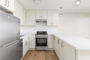 San Francisco apartment for rent - A modern kitchen with a stainless steel refrigerator and oven.