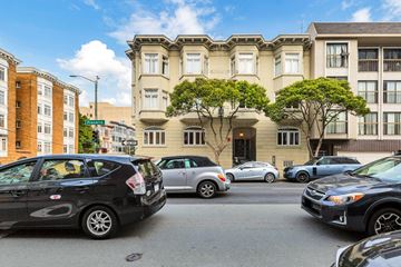 San Francisco apartment for rent - A black car is parked on the left side of the street.