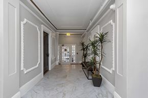 San Francisco apartment for rent - A long hallway with a plant on the right side.