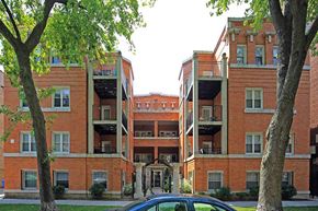 Chicago apartment for rent - a car is parked in front of an apartment building