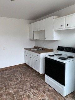 Glassport apartment for rent - A kitchen with a black stove top oven and white cabinets.