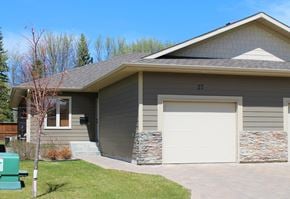 Brandon condo for rent - a gray house with a white garage door