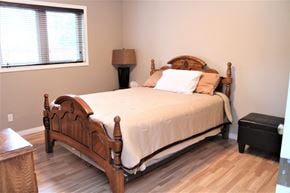 Brandon condo for rent - a bedroom with a bed and a window
