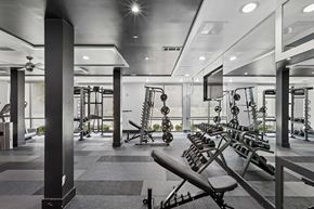 Nashville apartment for rent - A gym with a variety of equipment including weights and machines.