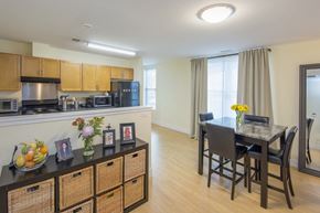 Northampton apartment for rent - a kitchen and dining room area with a dining table and chairs and a counter top