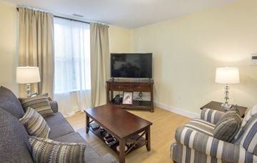 Northampton apartment for rent - a living room with couches and a coffee table and a television