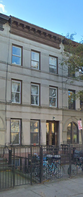 Brooklyn apartment for rent - A building with a brown top and windows.