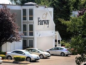 New Britain apartment for rent - a large building with cars parked in front of it