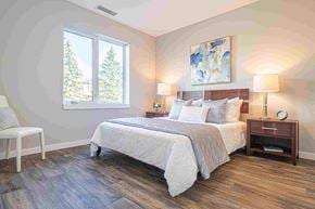 Winnipeg apartment for rent - a bedroom with a bed and a window