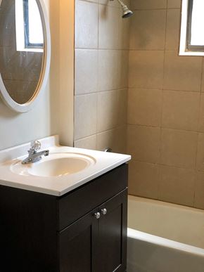 Oak Forest apartment for rent - A bathroom with a sink and a mirror.