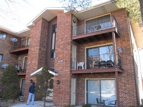 Oak Forest apartment for rent - a building with a person standing outside of it