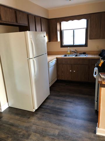 Oak Forest apartment for rent - a kitchen with a refrigerator and a sink