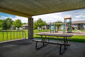 Anderson apartment for rent - a picnic table and playground equipment in a park