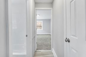 Philadelphia apartment for rent - a bedroom with a white door and a hallway with a window