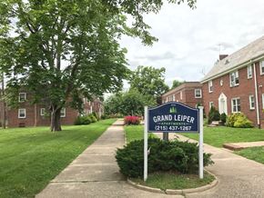 Philadelphia apartment for rent - a sign for grand leeper park in front of a brick building