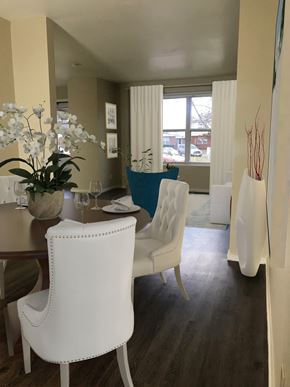Rantoul apartment for rent - a dining room with white chairs and a table