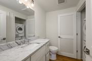 Kansas City apartment for rent - a bathroom with a sink and a toilet and a washing machine