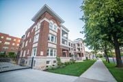 Kansas City apartment for rent - a large brick building with a sidewalk in front of it