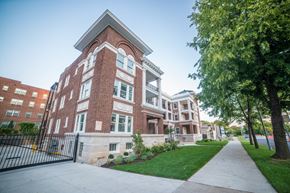 Kansas City apartment for rent - a large brick building with a sidewalk in front of it