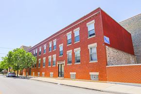 Chicago apartment for rent - a red brick building on the side of a street