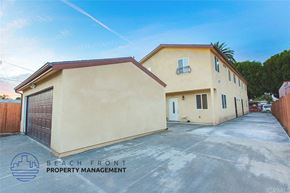 Los Angeles apartment for rent - A building with a sign that says Beach Front Property Management.