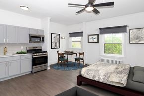Minneapolis apartment for rent - A modern kitchen with a dining table and chairs.
