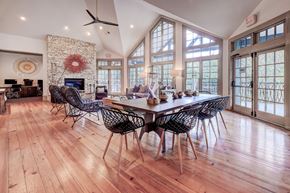 Austin apartment for rent - a large dining room with a table and chairs and a fireplace