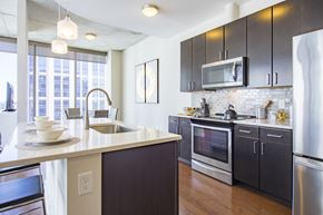 Atlanta apartment for rent - a kitchen with a large counter top and a sink and a microwave